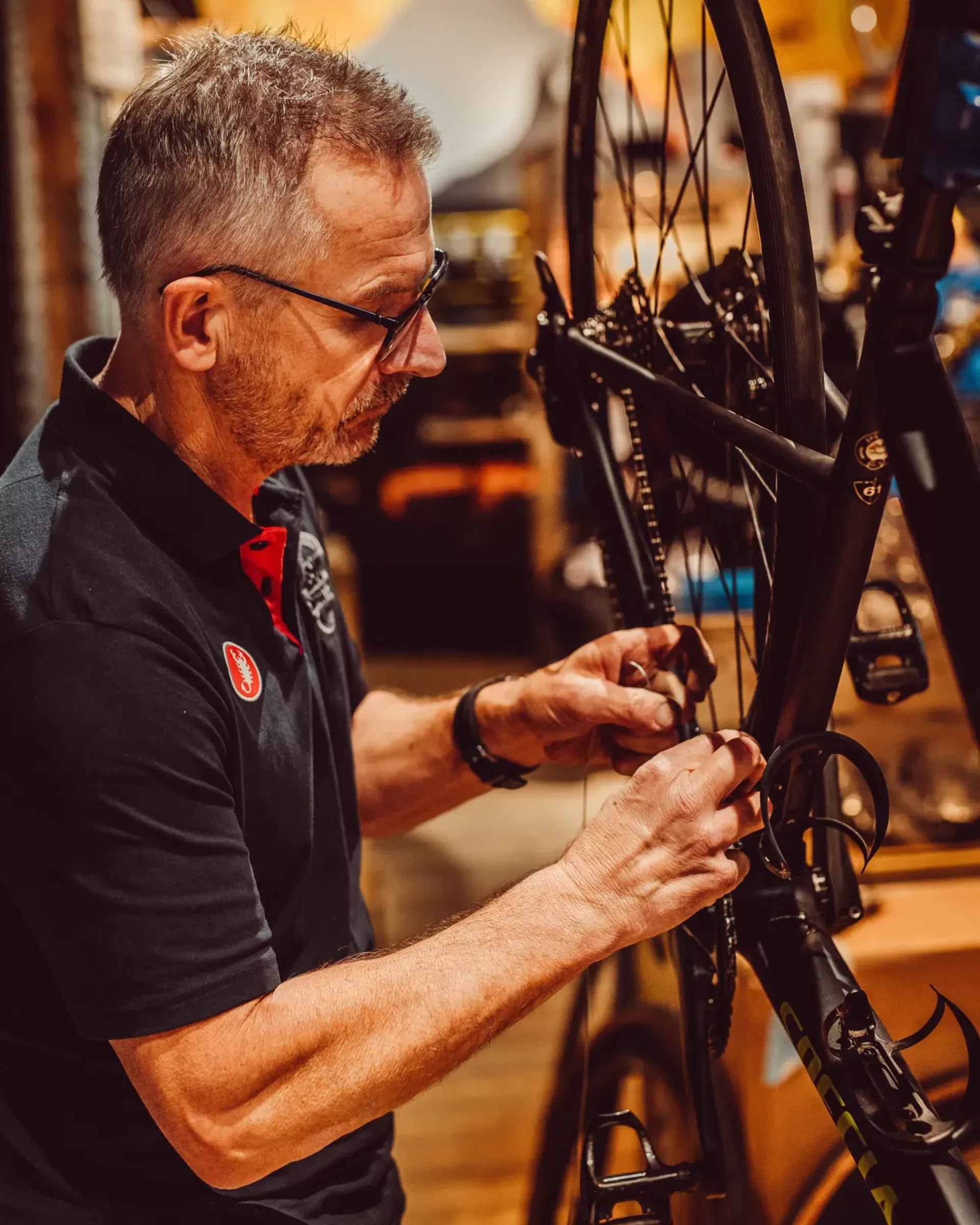 A Big Maggy&rsquo;s mechanic carrying out detailed bicycle maintenance