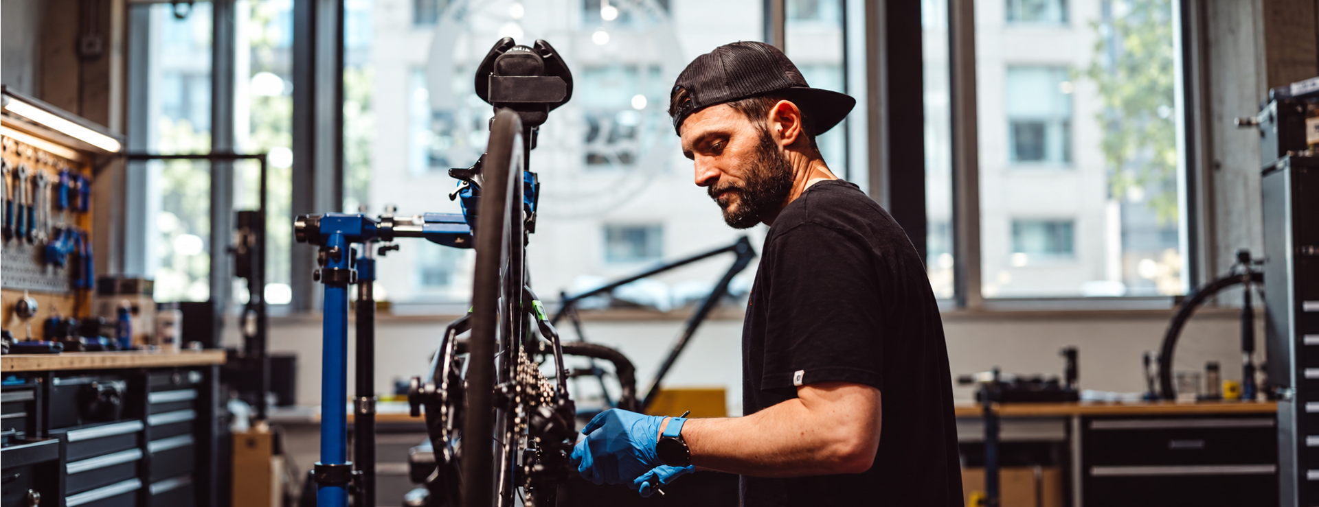 A Big Maggy&rsquo;s mechanic servicing a bicycle in our Jersey workshop
