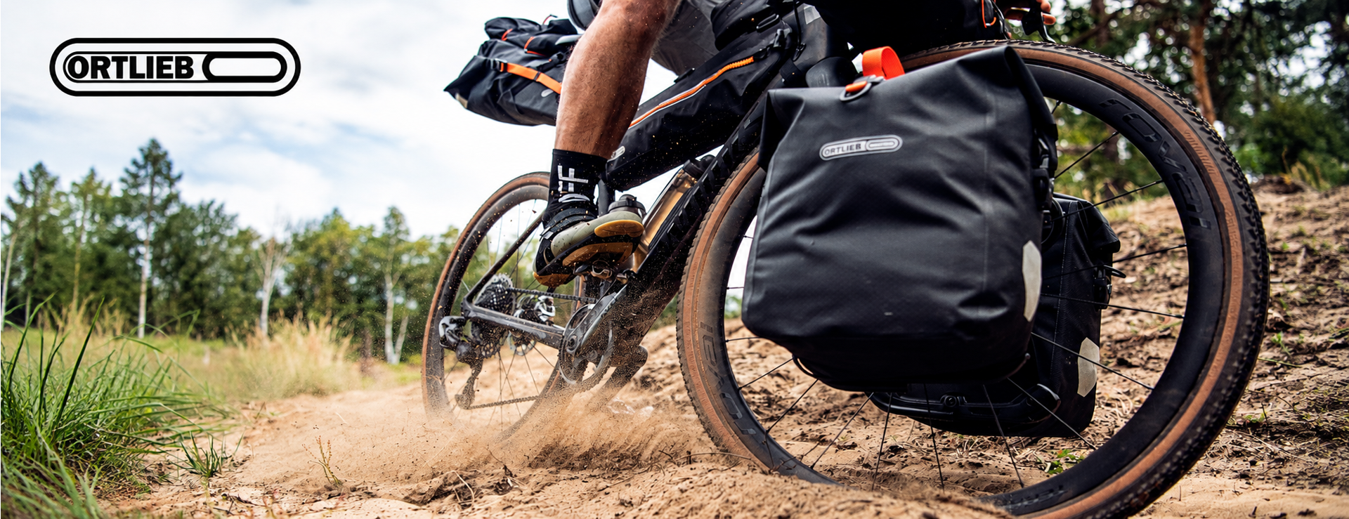Gravel riding through woodland with Ortlieb bikepacking panniers