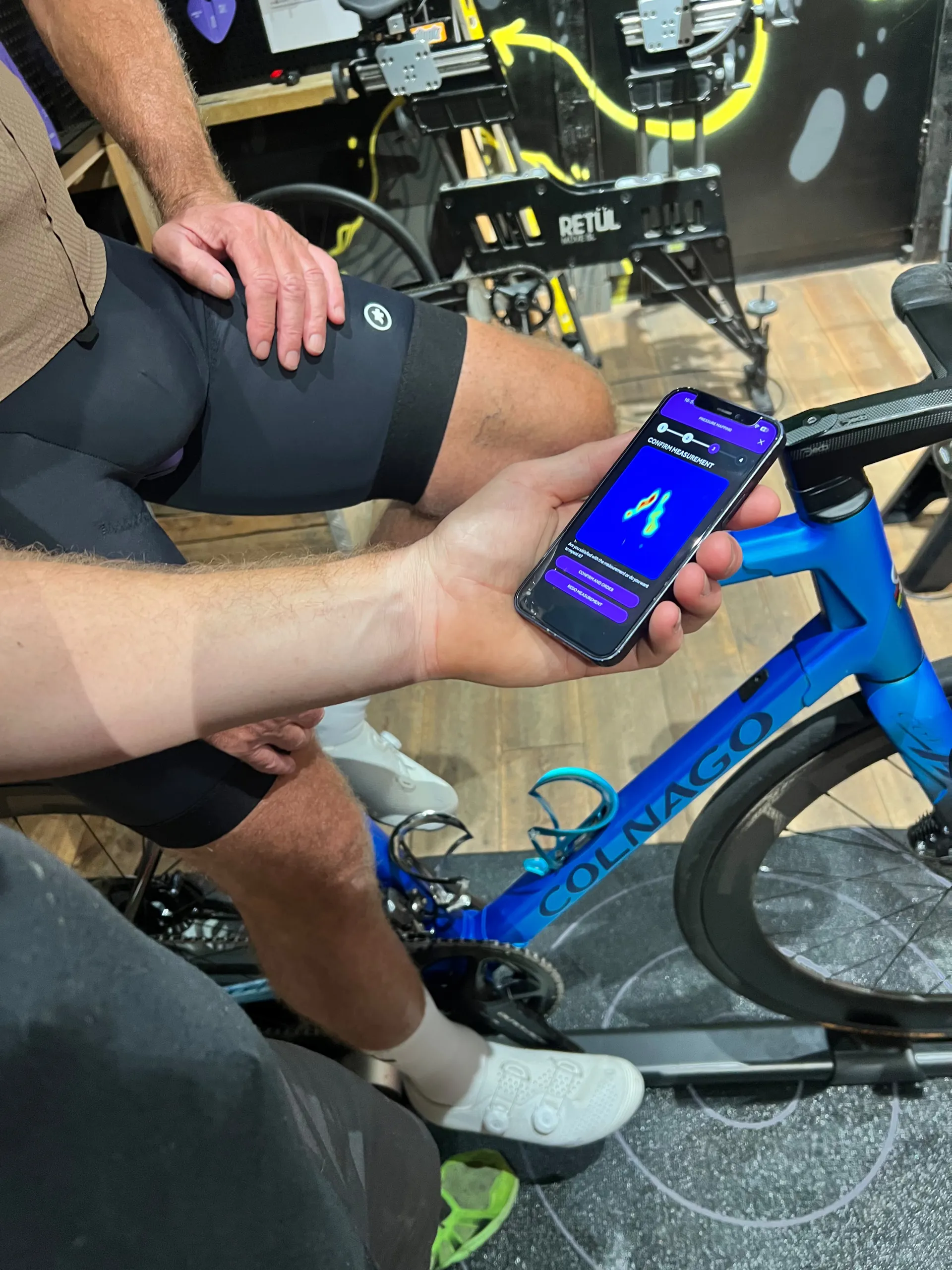 Reviewing saddle pressure-mapping data beside a rider on their own bike
