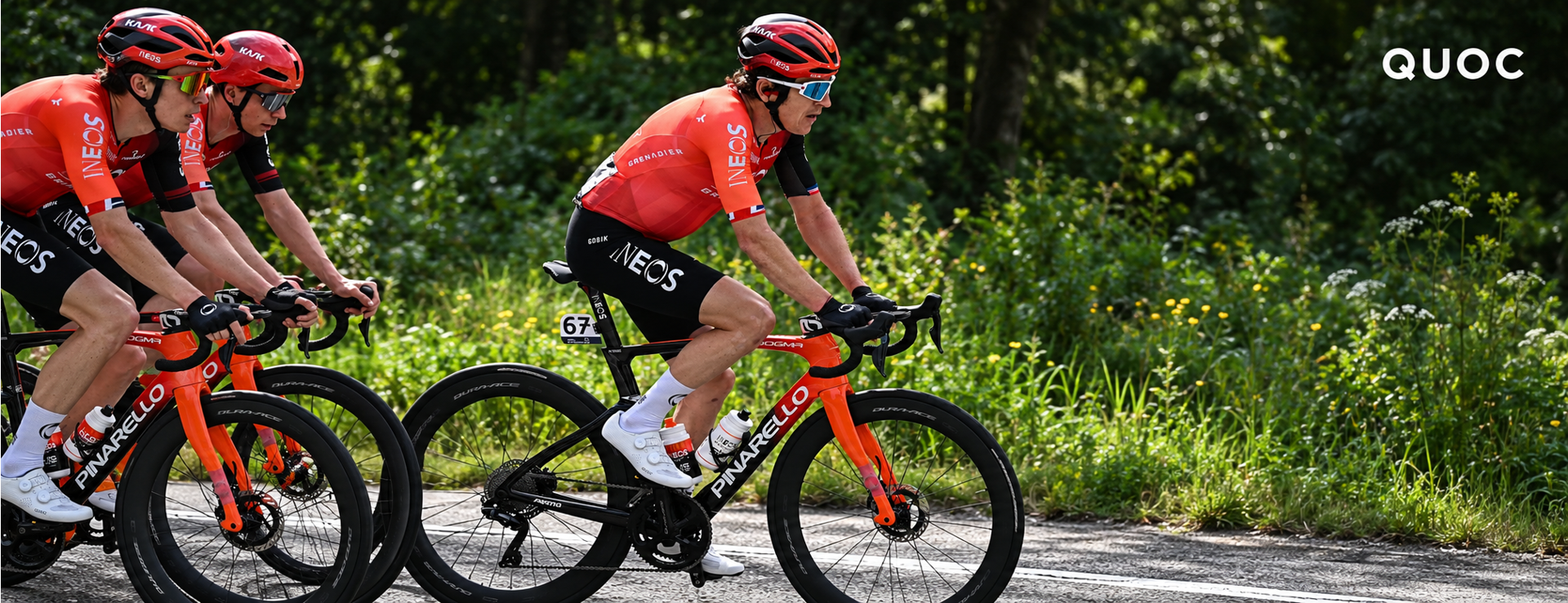 Geraint Thomas riding with INEOS teammates wearing white QUOC cycling shoes
