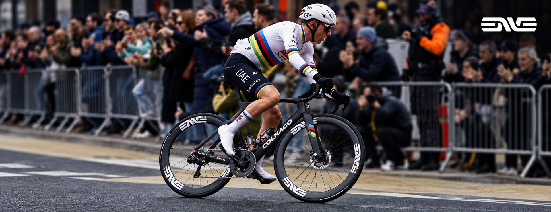 Tadej Pogacar riding a black Colnago fitted with ENVE carbon wheels