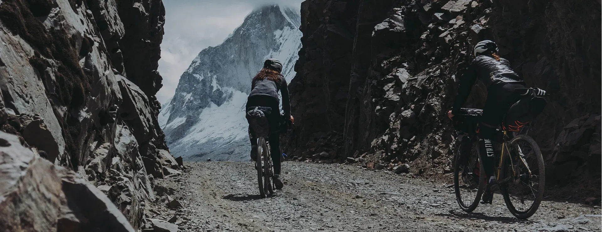 Riders exploring a mountain pass with Restrap bikepacking bags